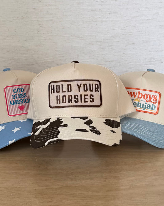 The Hold Your Horsies Cap — Ivory Snapback with Cow Print Bill (OS)