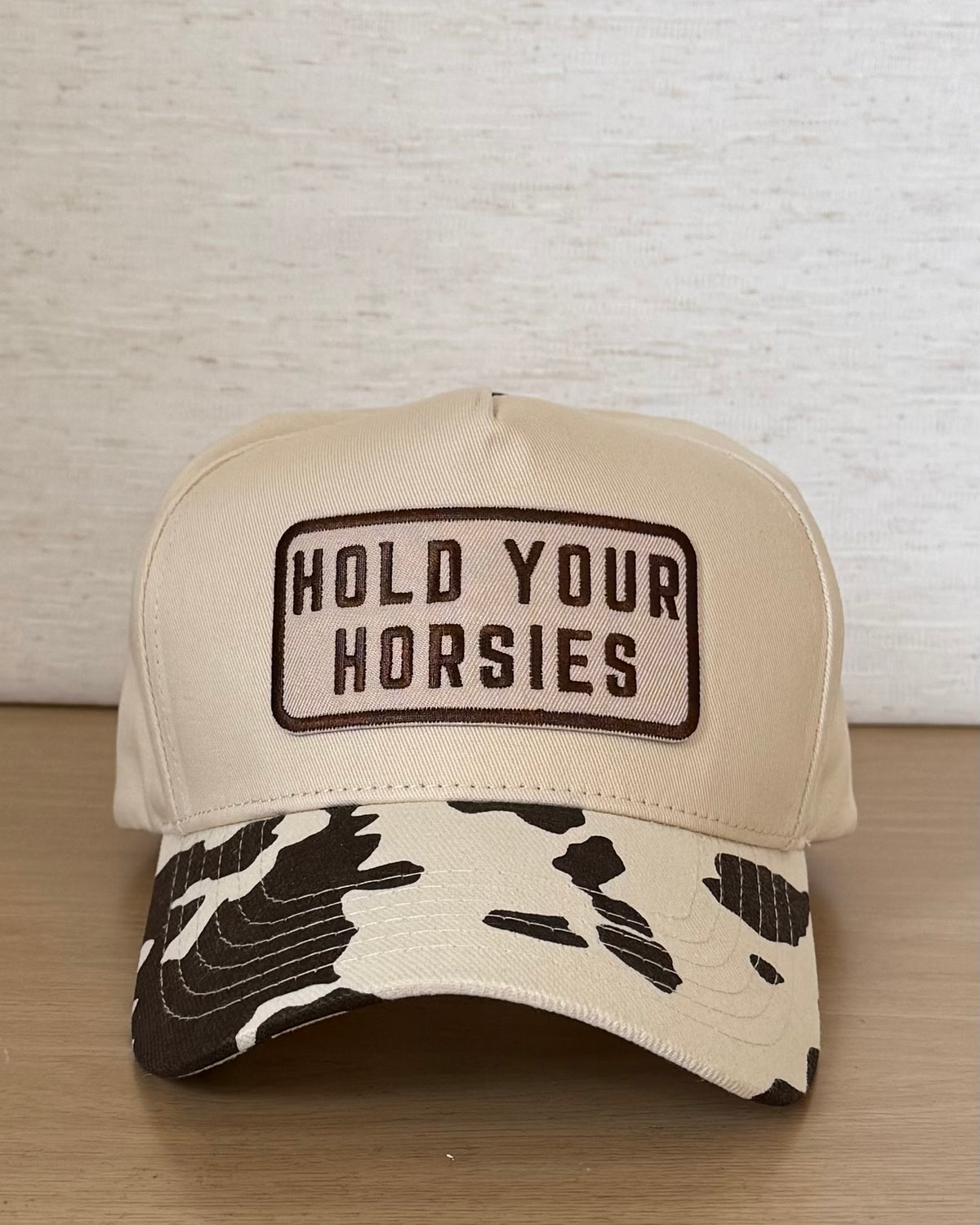 The Hold Your Horsies Cap — Ivory Snapback with Cow Print Bill (OS)